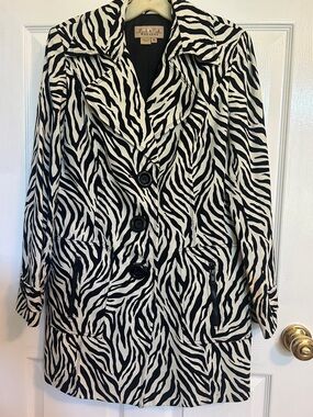 Women’s Peck and Peck Weekend animal print  lines topper coat.
